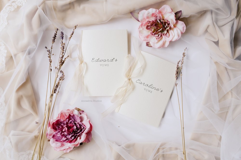Handmade vow booklets, on embossed Japanese paper and bound with delicate silk ribbons.