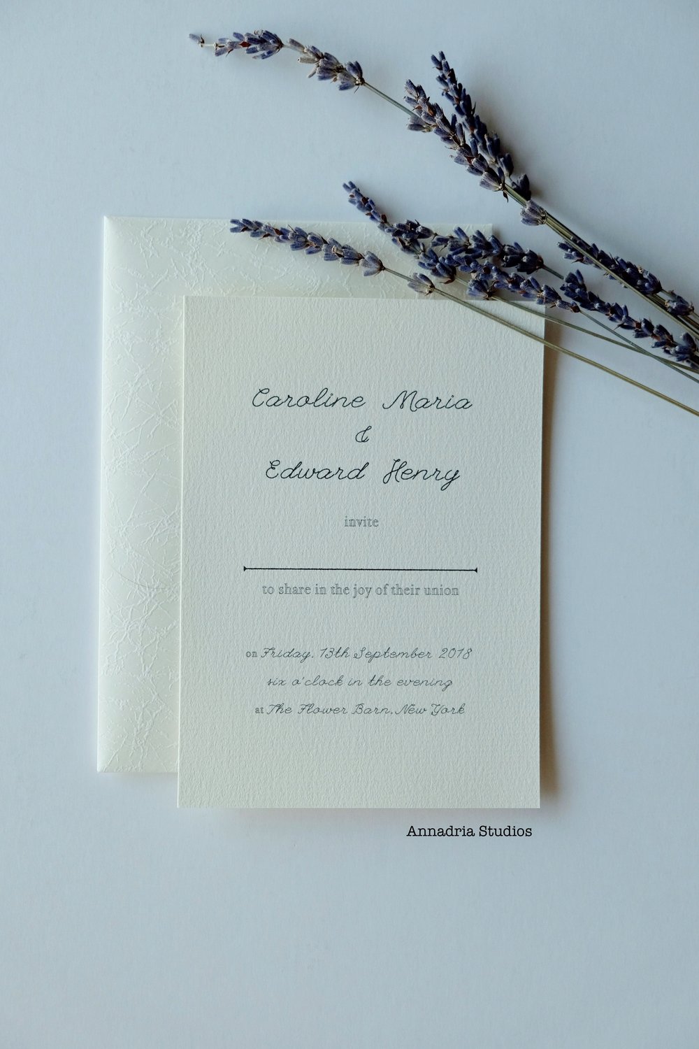 Invitations with guest names, designed by  Annadria Studios .